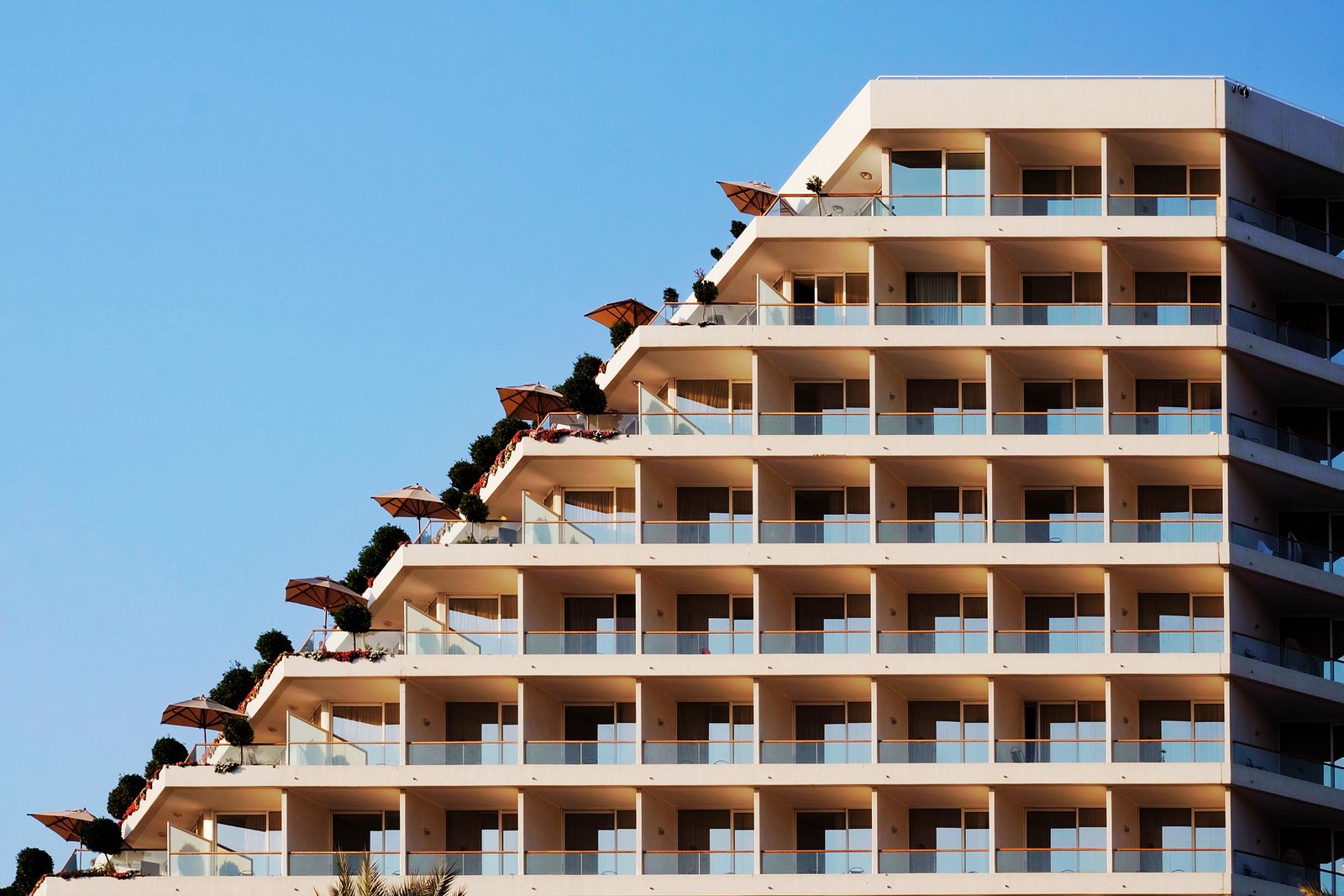 Resort hotel building exterior compared in hotel vs multifamily tax benefits