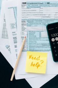 Tax documents on a table for year-end tax planning for accredited investors