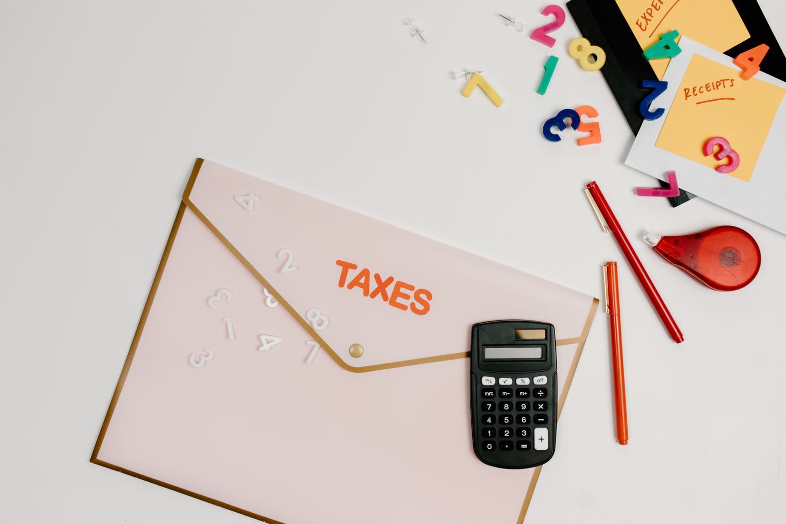Calculator on paperwork used in year-end tax planning for accredited investors