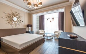 Furnished hotel guest room with bed, lamps and furniture that qualify for hotel FF&E depreciation